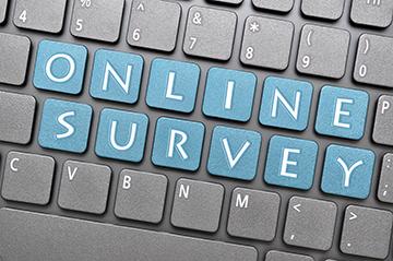 Blue keys spelling Online Survey on gray keyboard