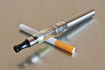 photo of cigarette and vaping device